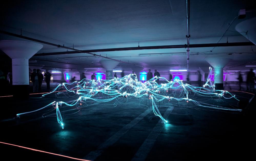 Linked neon lights in parking garage