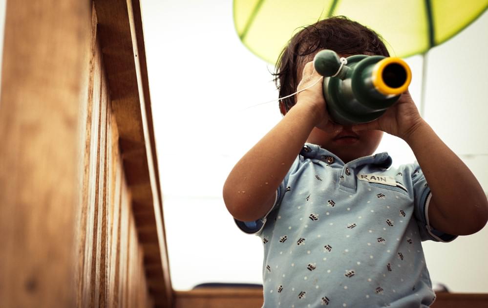 Curious toddler using monoscope