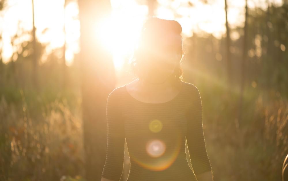 Woman standing in sun