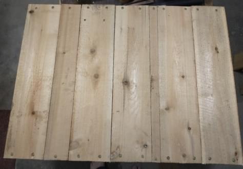 Planks of wood on white wall