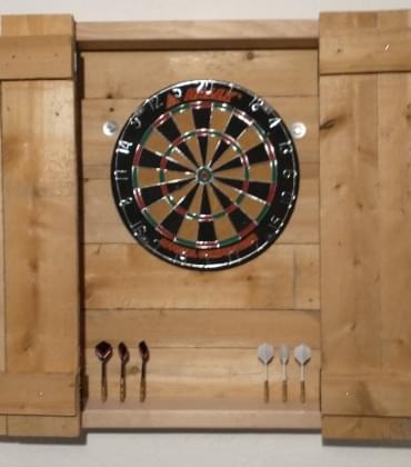 Heavily cropped dart board cabinet with doors open.