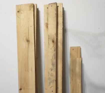 Planks of wood on white wall